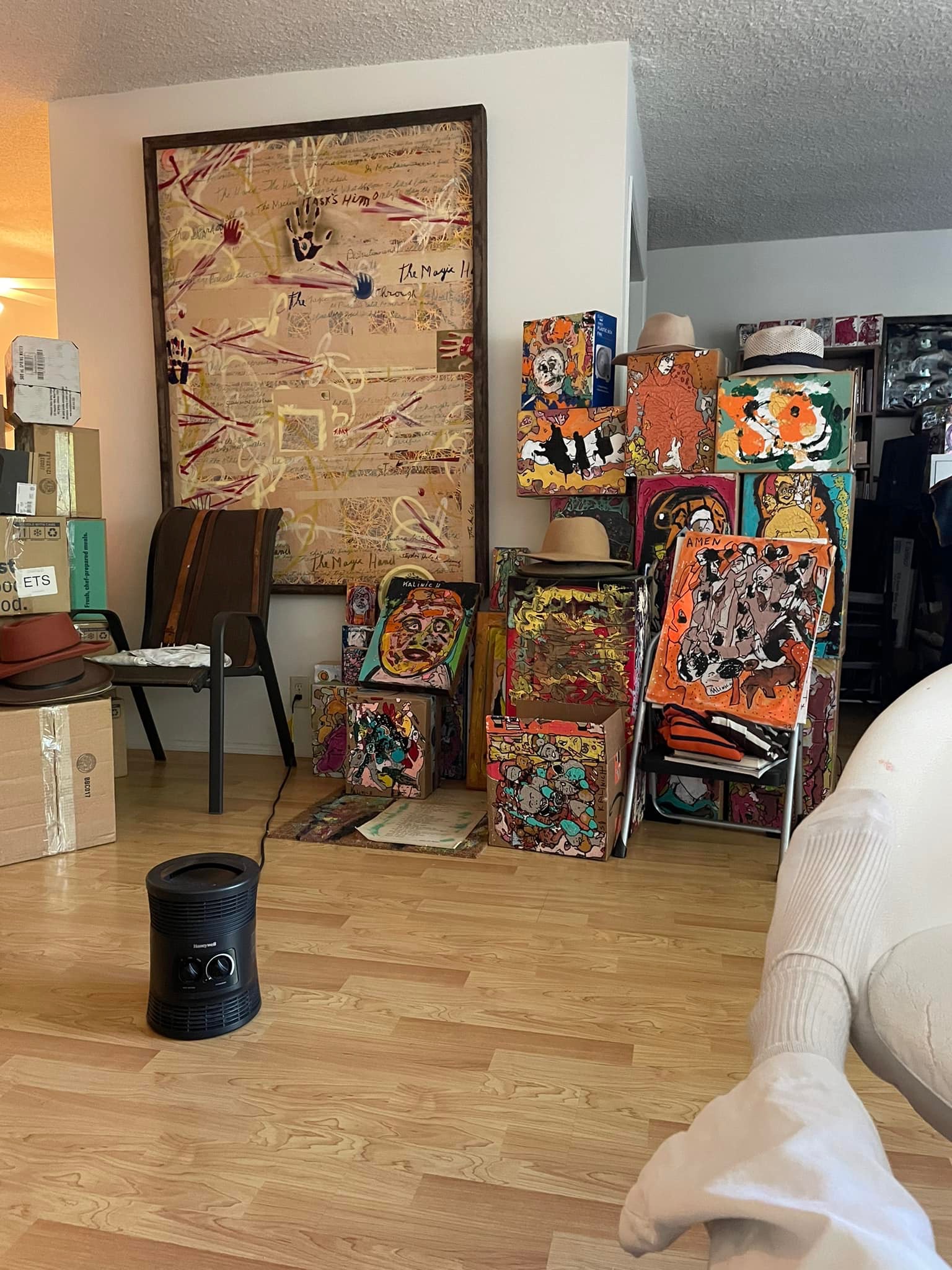 Stephen John Kalinich's paintings and painted boxes displayed in his home